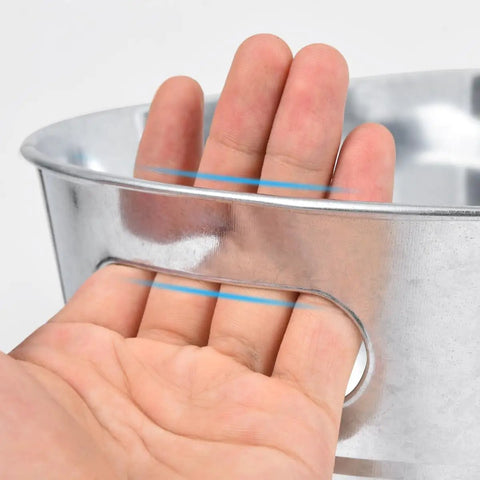 Close-up of hand holding Quad Pack Four Gallon Galvanized Ice Buckets With Heavy Duty Carry Handles For Beers Wines Cocktails And More Rust Proof Leak Proof Metal Cooler Tubs For Home Parties Bar Great For Beer Chillers And Wine Serving At Home Parties Or Bar Settings
