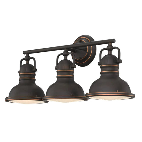 Vintage Style Three-Light Indoor Vanity Light Fixture In Oil Rubbed Bronze With Highlights And Frosted Prismatic Acrylic Lens.