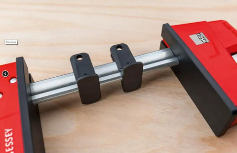 Top Shelf K Body Revo Clamp Kit Including Two 24 And Two 50 Inch F Clamps With Quick Slide Wideners detailed view of clamp mechanism.