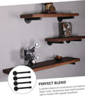 Rock Solid Heavy Duty Wall Mounted Shelf Brackets Four Pack Black Iron Pipe Style holding wooden planks with décor.