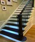 Indoor staircase with wooden steps and balusters using 1/2 Inch Iron Baluster Flat Shoes for Indoor Stairs, Satin Black Stair Parts.