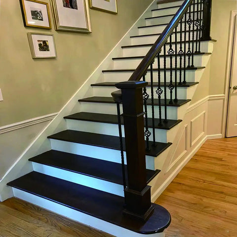 Indoor staircase with wooden steps and balusters using 1/2 Inch Iron Baluster Flat Shoes for Indoor Stairs, Satin Black Stair Parts.