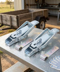 Heavy Duty Utility Trailer Lift Gate Latches Replacement Handle 2 Pack on metal table ready for installation.