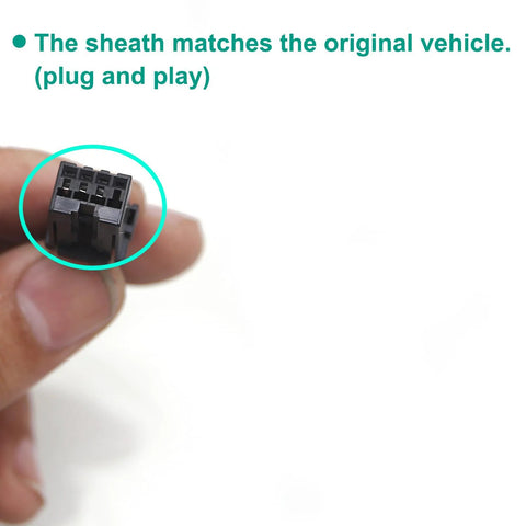 Close-up of black rectangular multi-pin motorcycle connector held between fingers