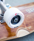 608-RS ball bearing visible in white skateboard wheel mounted on wooden deck; shielded 8x22x7 mm