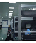 Industrial manufacturing facility with shelves containing electronics equipment.