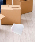 Fifty Pack Small Bubble Mailers 10x10 Plus 3cm Self Seal Padded Envelopes with boxes in background