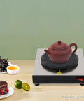 Straight Up Coffee Pot Warmer Hot Plate Keeping Daily Brews And Teas Properly Toasty With Reliable Eighty Watt Steady Heat For Kitchen Counters Or Office Desks, with a teapot.