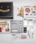Old School Steam Engine Model That Really Works With Boiler And Reversible Horizontal Design Includes Generator And Vintage Lamp For Realistic Hands On STEM Learning And A Fun Gift For Adults, 18x18x20 cm kit parts laid out