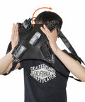 Person demonstrating Lightweight PU Sword Carry Bag With Back Strap Waistband For Ninja Cosplay Dual Sword Holder Adjustable Straps