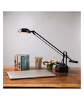Halotech 29-Inch LED Desk Lamp With Tilting 4-Inch Metal Shade, Black Matte Finish, Counterbalanced Arm, on Wooden Desk