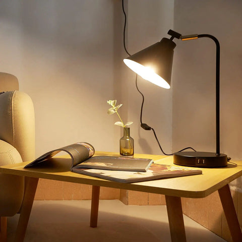 Dimmable Touch Bedside Lamp With 2 USB Ports And AC Outlet Industrial Black Nightstand Reading Light With Metal Flexible Gooseneck on table.
