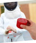 Person holding Pro Grade Fencing Gear Testing Sensor and Electric Testing Station, focus on rugged build and quick results.
