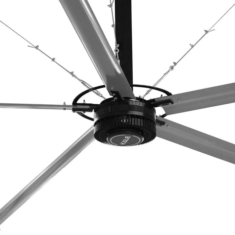 20 Ft HVLs Industrial Ceiling Fan Operating As A True Factory Workhorse Delivering Top Shelf Energy Savings Through A Sleek 3 Phase PMSM Setup close-up view of motor and blades.