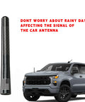 Flag Style Carbon Fiber Short Truck Antenna With Valve Stem Caps Universal Mast For Silverado F150 F250 F350 Avalanche And Other Rigs Black Weatherproof Easy Install Car Accessories next to a Silverado truck