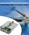 Universal PCB Holder And Jig Fixture Clamp For Soldering Desoldering And Quick Rework Stainless Steel Motherboard And Circuit Board Holder 12x8 cm showing a circuit board clamped for soldering.