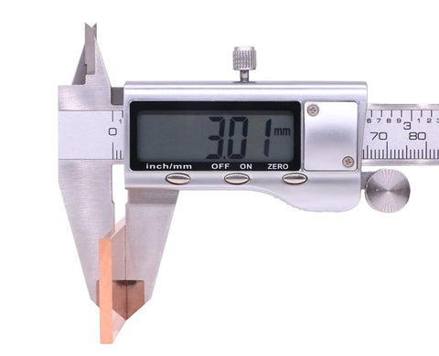 Caliper measuring 3 mm thickness of Copper Flat Bar C110 Grade One Eighth Inch Thick By One Inch Wide By Twelve Inch Long Solid Copper Plate Stock