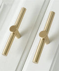 Brushed Brass Cabinet Knobs 4 Pack T Bar Cabinet Pulls Gold Finish 3.9 Inch Length Single Hole Drawer Handles installed on white cabinetry