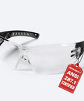 Badass Heavy Duty Safety Glasses Featuring Anti Fog And Scratch Resistant Lens For High Impact Protection And UV Blocking On Construction And DIY Sites Ansi Certified In Black with clear lenses and black accents.