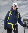 Woman wearing 3 In 1 Winter Ski Jacket With Fleece Liner, Waterproof Outer Shell And Windproof Inner Layer, snow-capped mountains background