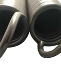 Heavy Duty Extension Springs Pair With .309 Inch Wire And 2.25 Inch Outside Diameter Measuring 20.25 Inches Long close-up at one end.
