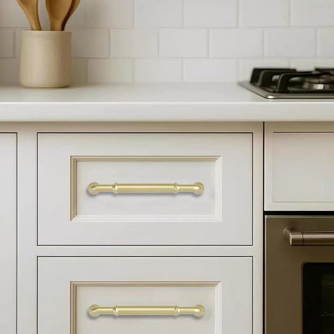 Brushed Gold Cabinet Pulls 2 Pack Three and Three Quarters Inch Center to Center 4.4 Inch Length installed on white kitchen drawers.