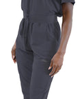 Womens High Waisted Slim Fit Jogger Scrubs For Nurses And Doctors Featuring Snatched Waist Silhouette, side view with tool pockets.