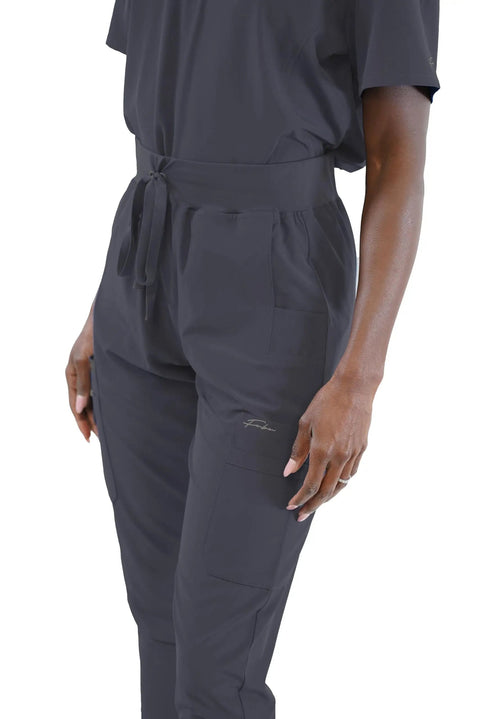 Womens High Waisted Slim Fit Jogger Scrubs For Nurses And Doctors Featuring Snatched Waist Silhouette, side view with tool pockets.