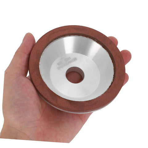 Heavy Duty Diamond Cup Grinding Wheel 100mm Silver Concave Abrasive Disc held in hand for tough metal polishing.