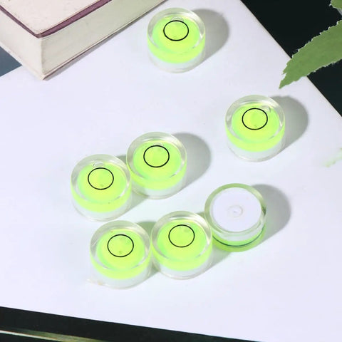 10pcs Bubble Spirit Level, High Precision Acrylic Tool on a flat surface, showcasing mini green bubble levels with clear casing.