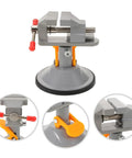 Rotating Small Bench Vise With Quick Release Mini Table Clamp for woodworking and jewelry repair DIY projects, gray metal with orange accents.