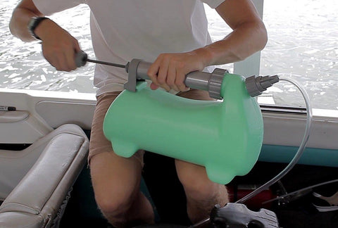 Person using LiquiVac MarinaPro 5000MP 8Qt Fluid Extractor For Boats And Small Engines Oil And Gas Pump on boat