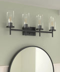 Winslett Lit Matte Black Bath Vanity Light With Clear Ribbed Glass Shades Transitional Steel Fixture mounted on wall