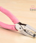 Heart Shaped Hole Punch For Crafting, 6.3 Inch Handheld Paper Punch With 1/4 Inch Heart Hole, pink leather cover, on wood surface