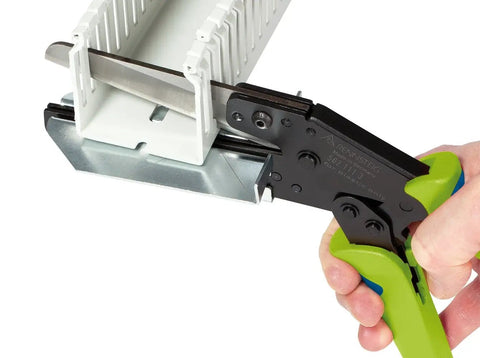 Wiring Duct Cutter For Plastic Panels Baseboards And Cable Ducts Up To Four And Half Inch Depth Handheld Tool in use on duct
