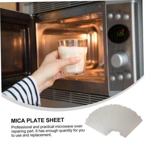 Hand placing glass of milk in microwave with Six Piece Microwave Mica Sheet Covers For Heat Shield And Insulation shown below