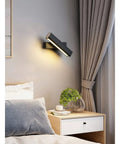 Elevate Your Home Vibe With This Sleek Black Metal Swivel Wall Sconce Led Lighting For Bedroom Living Room And Hallways Rustproof Adjustable Accent Lamp above a bedside table.