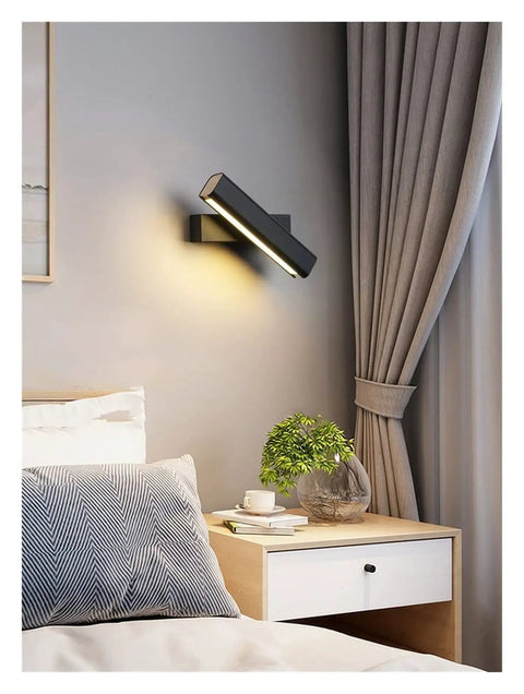 Elevate Your Home Vibe With This Sleek Black Metal Swivel Wall Sconce Led Lighting For Bedroom Living Room And Hallways Rustproof Adjustable Accent Lamp above a bedside table.