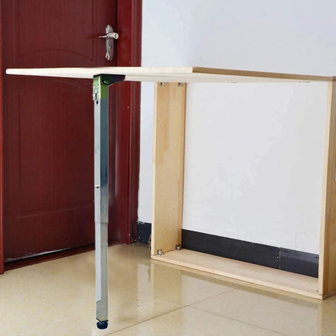 Built Tough Hassle Free Stainless Steel Folding Table Legs For Dining Desk And Bar Rig With Smooth Telescopic Adjustments and rock steady grip on a wooden table.