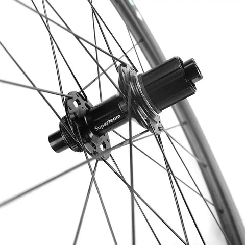 Close-up of a hub and spokes on a Carbon Disc Brake Wheelset 700c 50mm By 25mm Tubeless Ready For Road Biking Paint Free Finish Toray T700 Fiber