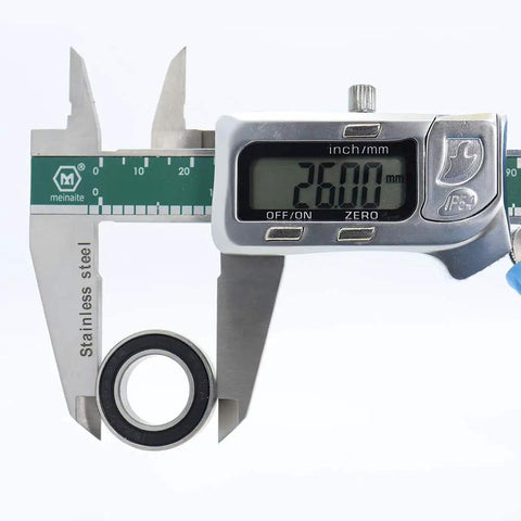 Digital caliper measuring 15x26x7mm ball bearing from 15x26x7mm Ball Bearing Set For Bicycle Rear Hubs Chrome Steel Rubber Sealed Smooth Spin Low Friction ISO 492 2005 Standard Compatible With American Classic Rear Hubs Pack Of Four Bearings