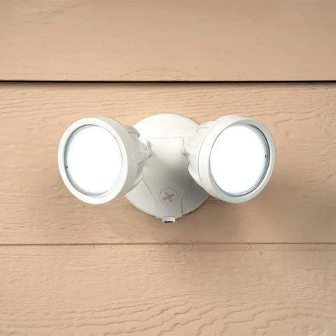 Outdoor Security Flood Light Twin Head LED Dusk To Dawn 1600 Lumens White with Photocell Sensor mounted on a wall