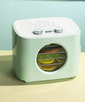 Electric Food Dehydrator With Badass Stainless Steel Trays And Sick 360 Hot Air Circulation, green with round window displaying dried fruit.