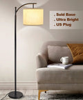 Three Head Arc Floor Lamp With Adjustable Arms Modern Farmhouse LED Standing Lamp in a cozy living room next to a sofa.