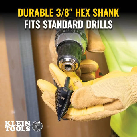 Person holding Ultimate Step Drill Bit Set For 7/8 To 1-3/8 Inch Holes With Double Fluted Design, Easy Read Step Markings, 3/8 Inch Hex Shank.