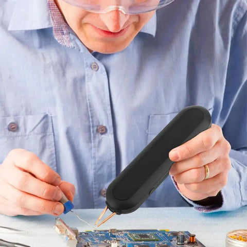 Man using Handheld Battery Spot Welder With 11 Gear Adjustable Controls And Built In Battery Tester Welds 0.1-0.25mm Nickel