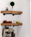 6 Pack 10 Inch Wall Mounted Industrial Pipe Clothing Rack Set built as shelving brackets with kitchen items displayed.
