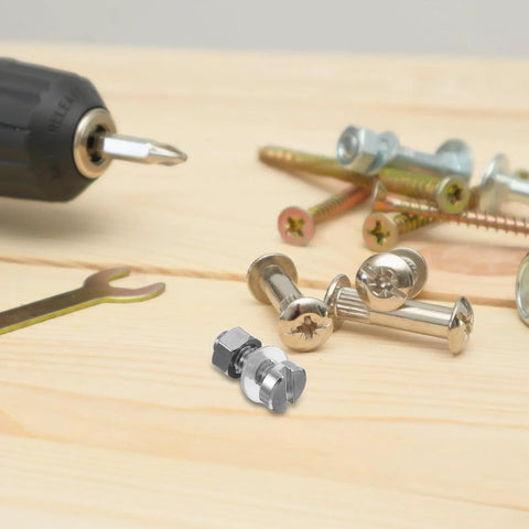 Pair M Two Point Five By Zero Point Four Five By Seven Pro Grade Miniature Screws for turntable repair kit, shown on wood surface.