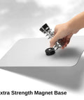 Hand adjusting magnetic base of 2 In 1 Magnetic Helping Hands Soldering Station With Silicone Mat And PCB Holder on white surface