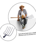 Heavy Duty Manure Fork And Garden Pitch Fork For Farm Use A Rugged Workhorse in use by farmer; close-up of fork design